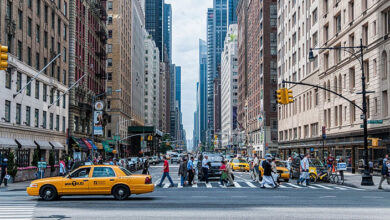 Where should tourists stay in a new city