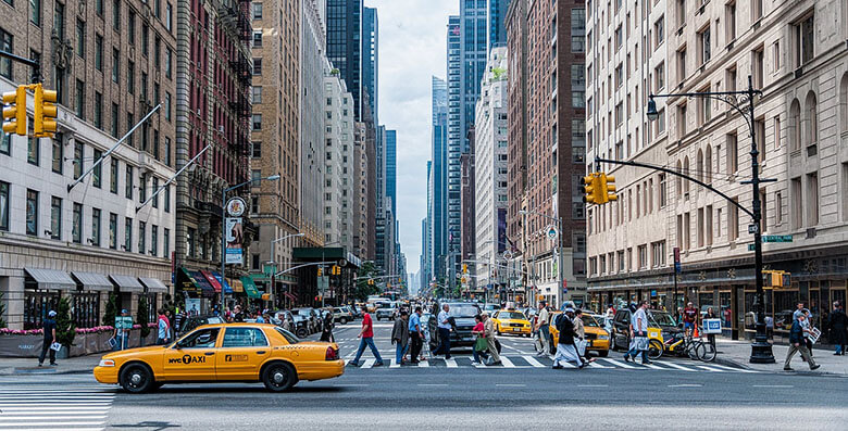 Where should tourists stay in a new city